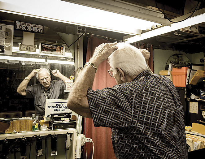 Del Puschert combs his hair