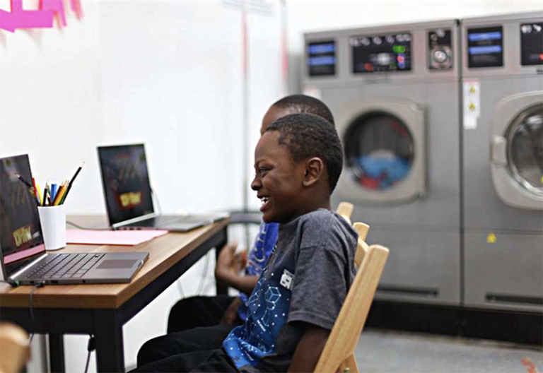 Enoch Pratt Brings Digital Resources to Local Laundromats Baltimore