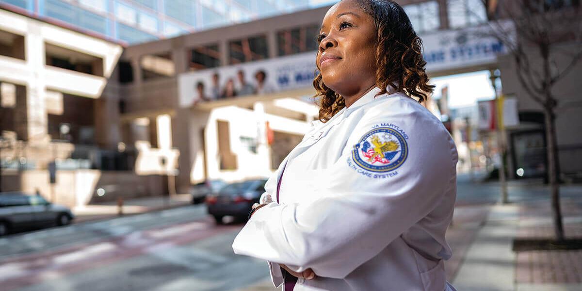 Nurse Lt. MeShondra Collins outside a hospital.