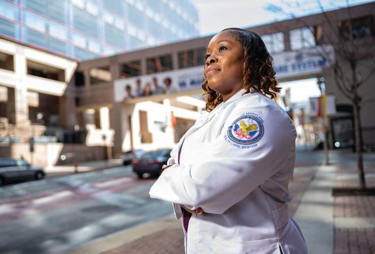 Nurse Lt. MeShondra Collins outside a hospital.