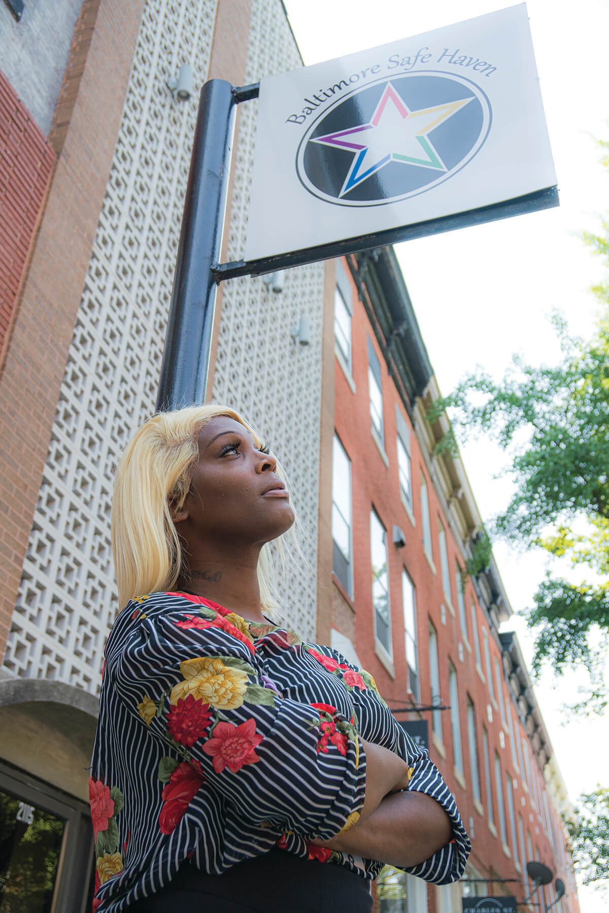 A photo of Iya Dammons in front of Baltimore Safe Haven in Charles Village.