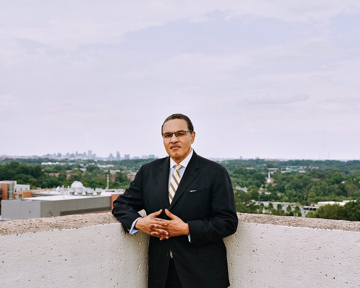 Freeman Hrabowski stands on the roof of the administration building at UMBC.