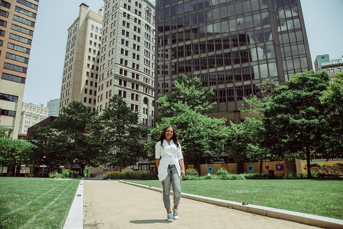 Stokes standing outside of the downtown partnership building.