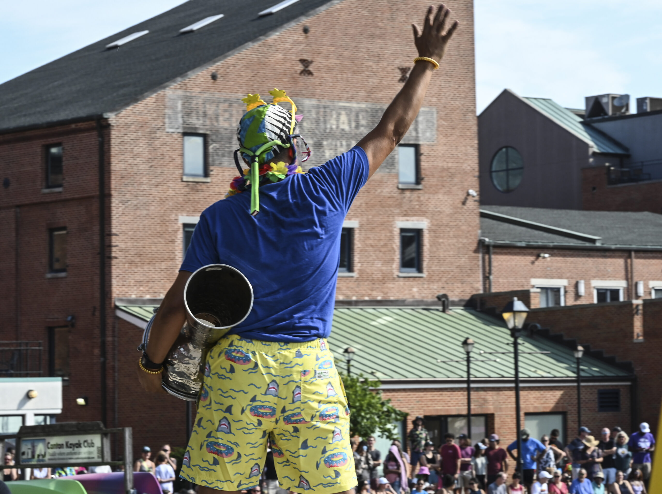 Despite the heat, 150 swimmers partied on Brown's Wharf befor taking the plunge into harbor waters at Fells Point.