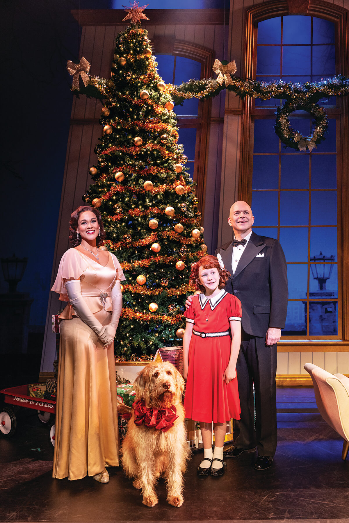 Julia Nicole Hunter as 'Grace Farrell', Christopher Swan as 'Oliver Warbucks' and Hazel Vogel as 'Annie' in the 2024-2025 National Tour of ANNIE. Photo by Matthew Murphy, MurphyMade_CMYK